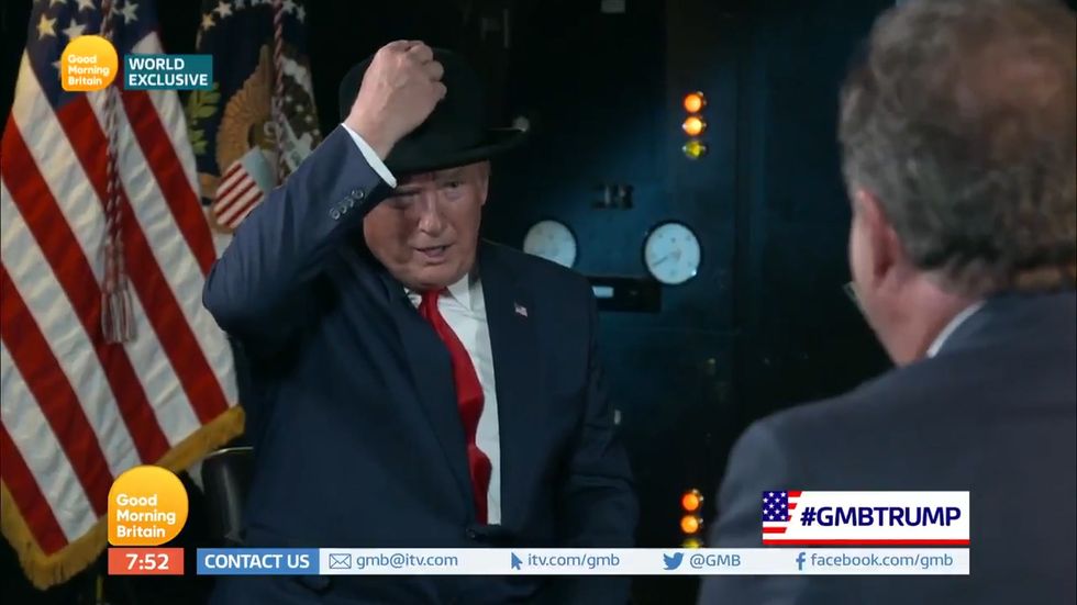 Piers Morgan presents Donald Trump with a 'Winston Churchill' style hat