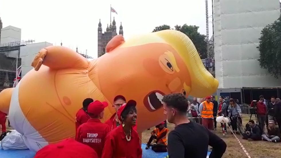 Protesters inflate Trump baby blimp