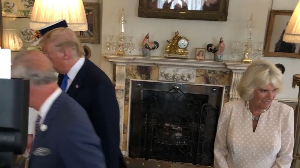 Camilla winks at cameras as Prince Charles escorts Donald Trump to afternoon tea