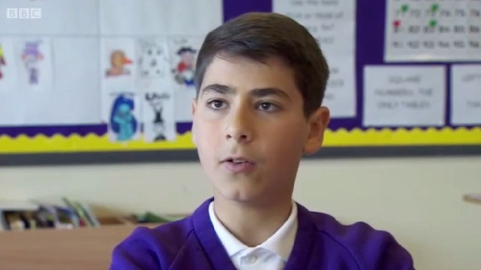 Syrian primary school pupil acts as an interpreter for his classmates