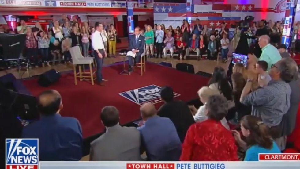 Pete Buttigieg tears into Tucker Carlson and Laura Ingraham at Fox News town hall - then gets standing ovation