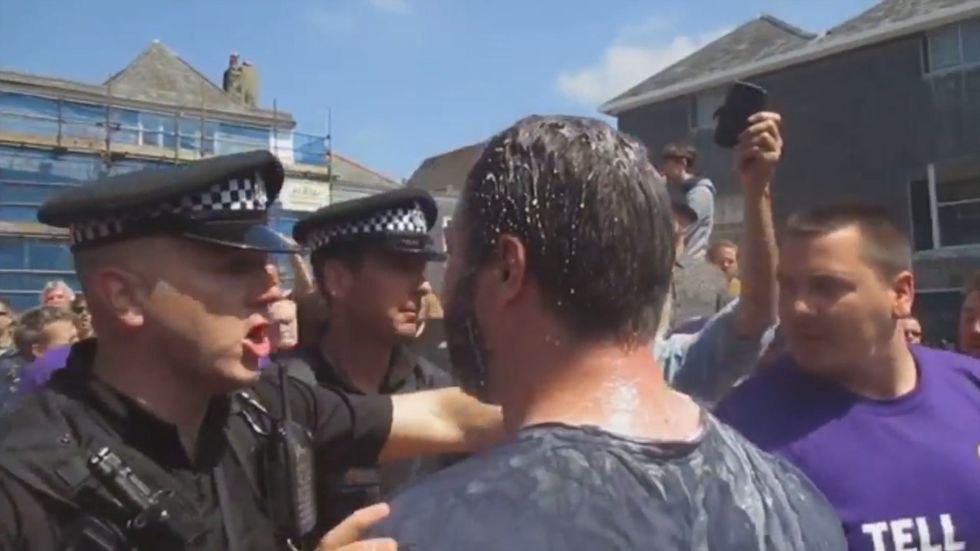 Protesters cover Ukip EU candidate Carl Benjamin in milkshake during Totnes visit