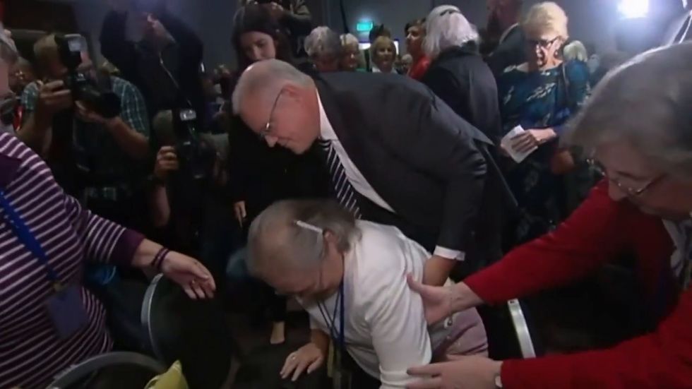 Protester tries and fails to smash egg on Australian PM Scott Morrison