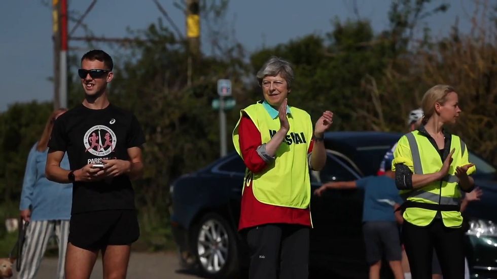 Theresa May participates as marshal Easter race in Maidenhead