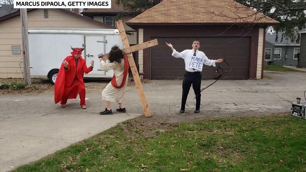 Homophobic protester dressed as Pete Buttigieg whips man dressed as Jesus