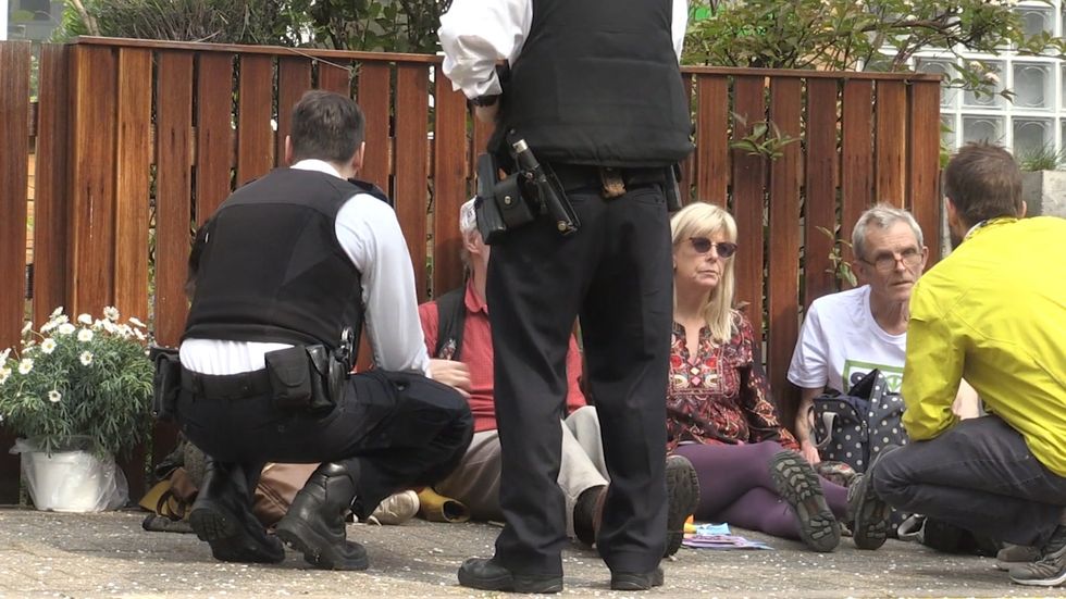 Environment protesters glue themselves together outside Jeremy Corbyn's house