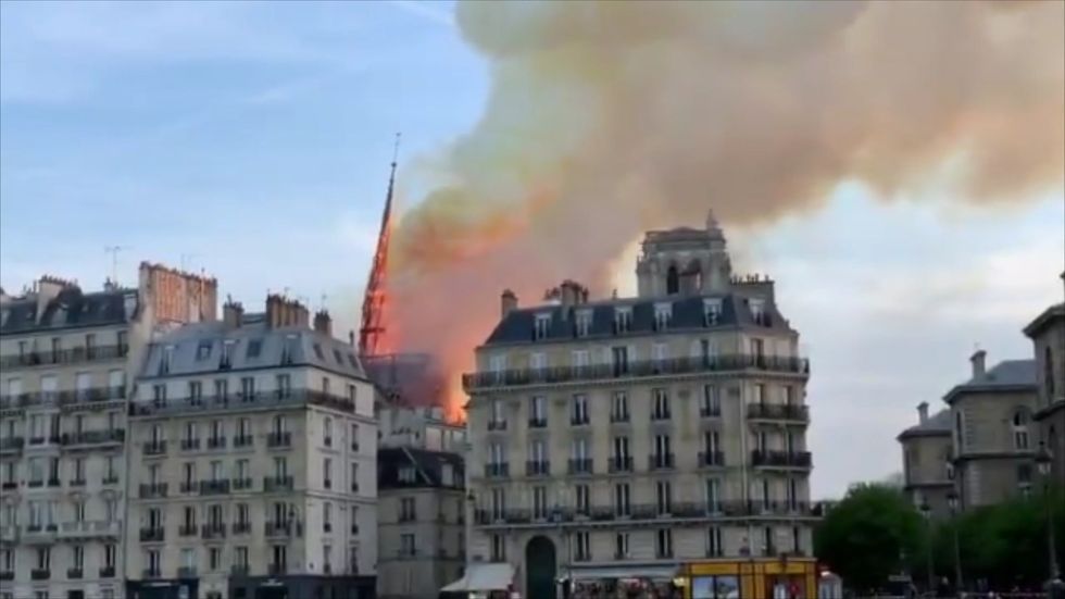 Devastating moment Notre Dame cathedral spire topples over into bed of flames during huge fire