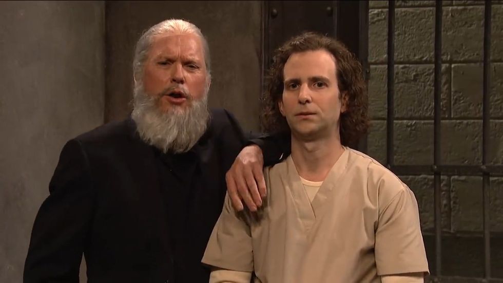 Michael Keaton appears as Julian Assange on SNL
