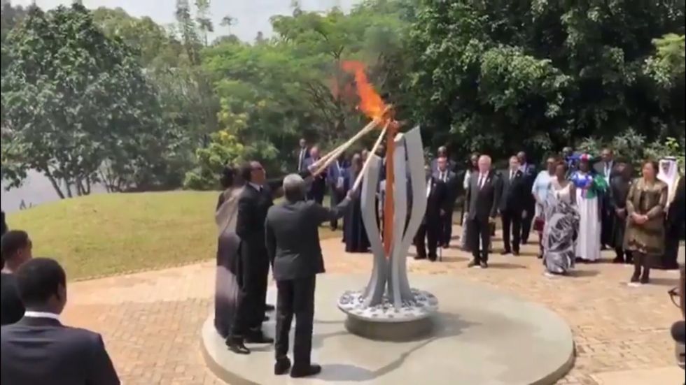 Jean-Claude Juncker narrowly avoids setting Rwanda's first lady on fire during ceremony to commemorate genocide