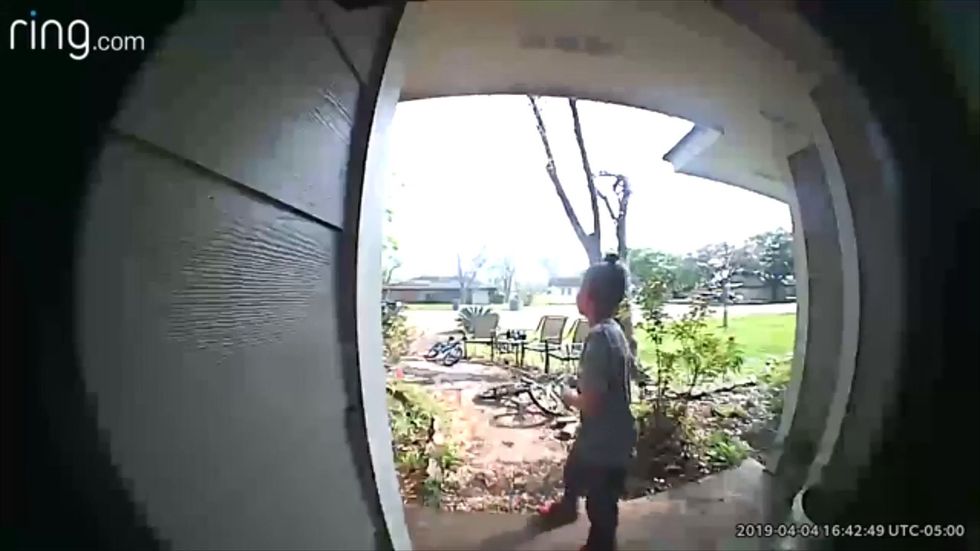 Man caught on CCTV stealing young boy's bike in front of him