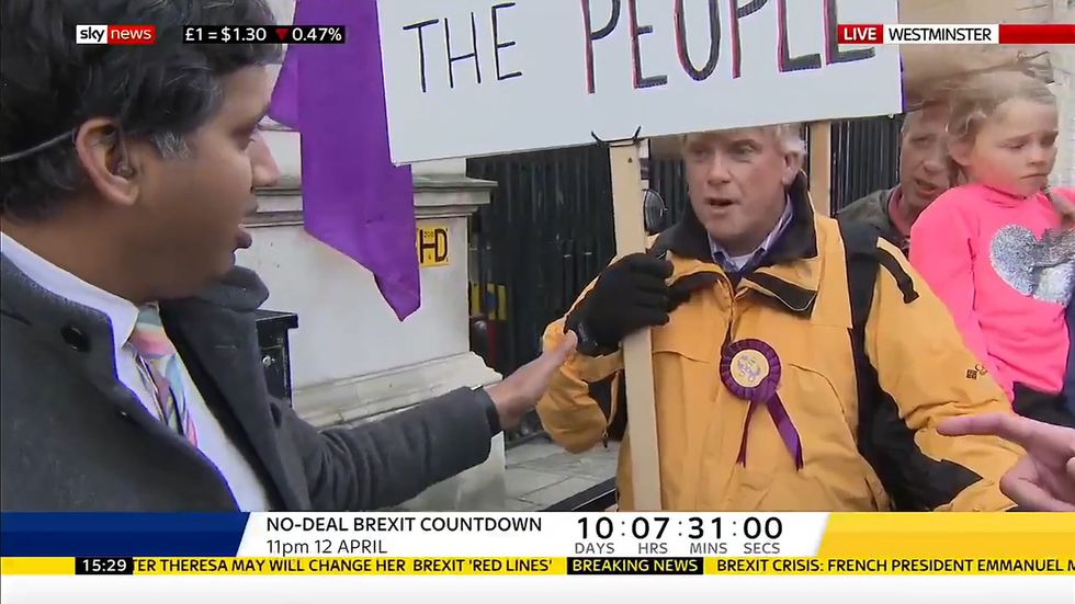 Faisal Islam asking a pro-Brexit protester why he feels it is appropriate to call the Prime Minister a traitor