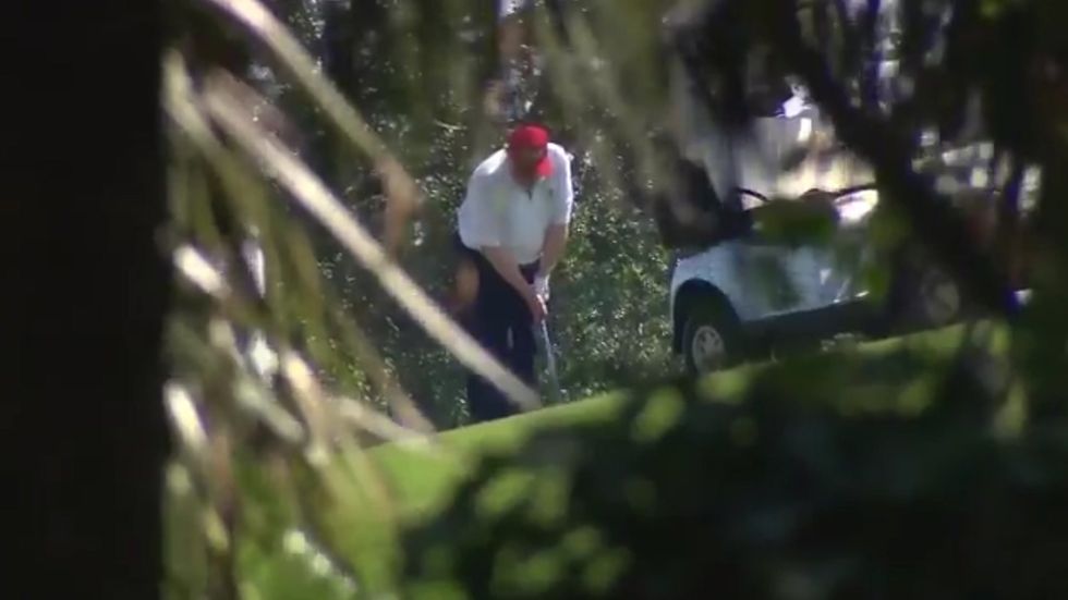 Donald Trump plays golf with Kid Rock at Trump International Golf Club in Florida