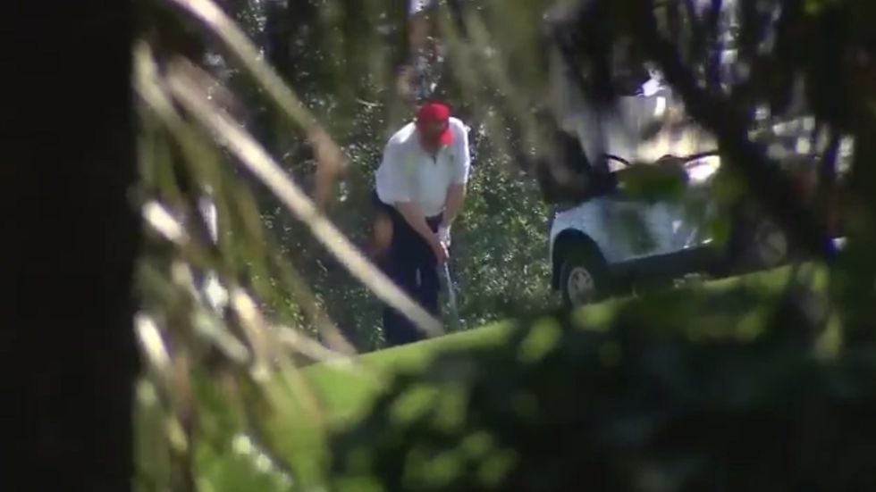 Donald Trump plays golf with Kid Rock at Trump International Golf Club in Florida