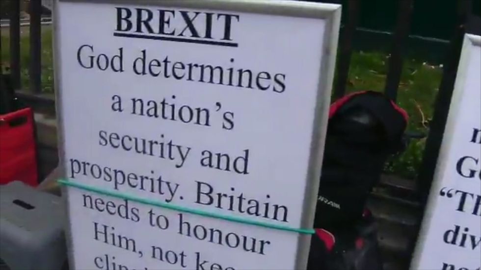 Brexit activists outside of parliament claim that God and the Bible is against the EU