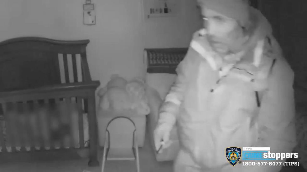 Couple spot burglar in sleeping babys room on security camera