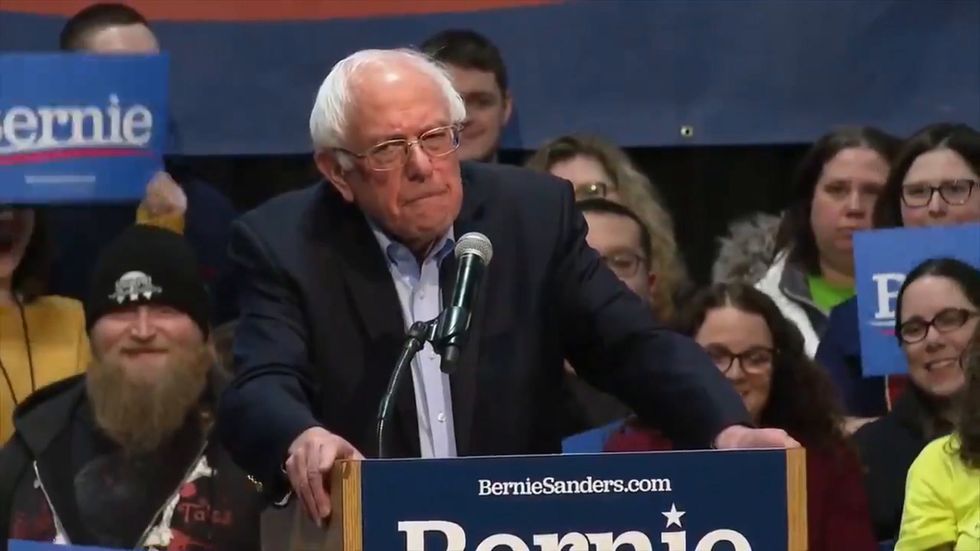 Bernie Sanders laughs as heckler directs 'f**k you' at Donald Trump over climate change
