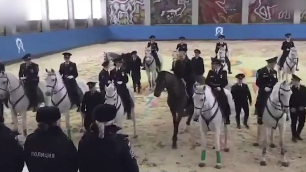Putin's horse doesn't want to obey as the president joins women of 1st Operational Police Regiment in Moscow
