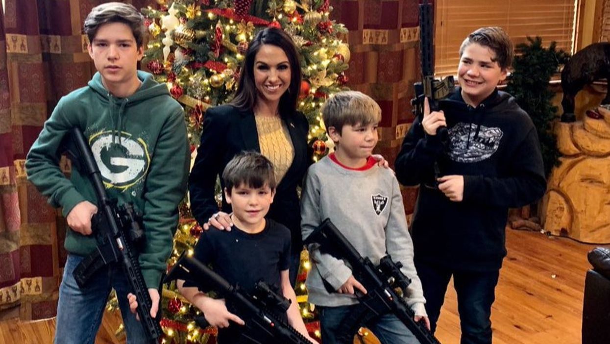 A second Republican has shared a Christmas picture with kids holding guns