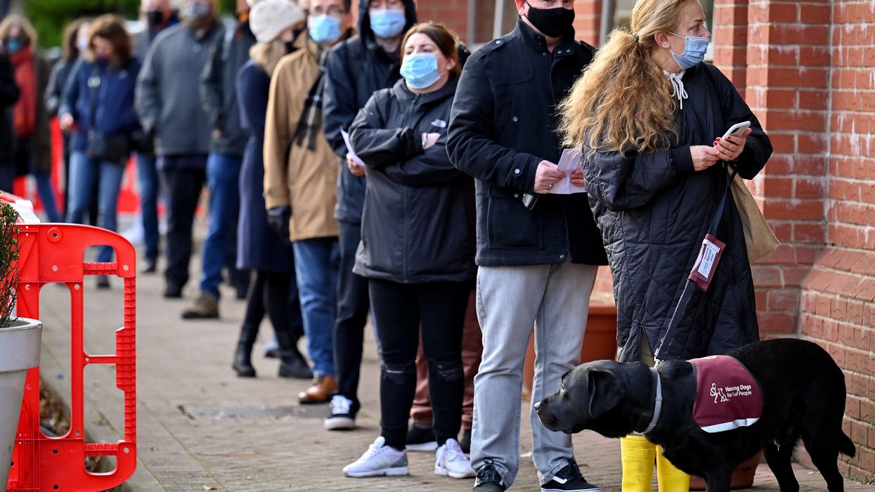11 photos of massive queues at booster jab centres as push to slow spread of omicron variant continues