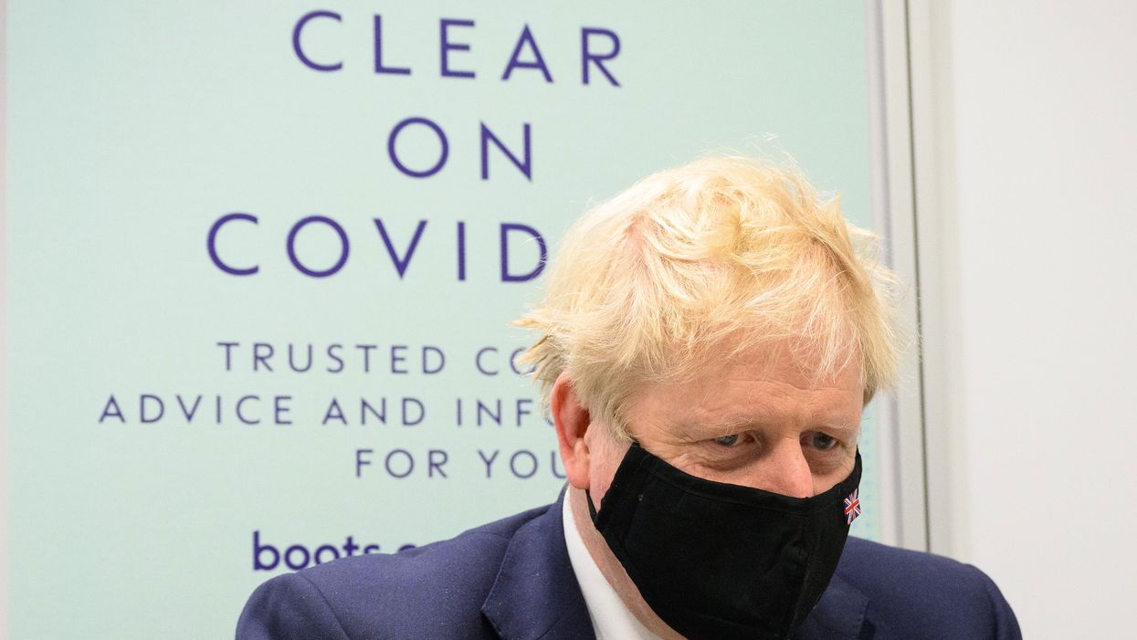 Prime Minister papped beside ‘Be Clear on Covid’ poster and Twitter loved the irony