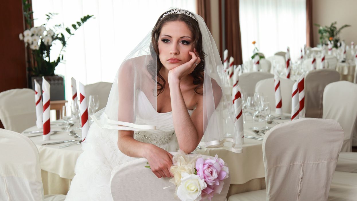 Woman sparks debate after uninviting stepdad from her wedding even though he paid for it