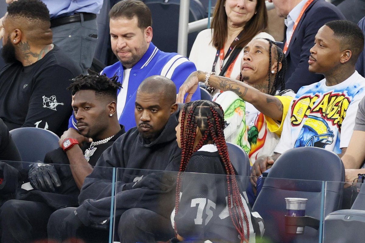 Kanye West is booed by crowd as he attends Super Bowl with his kids