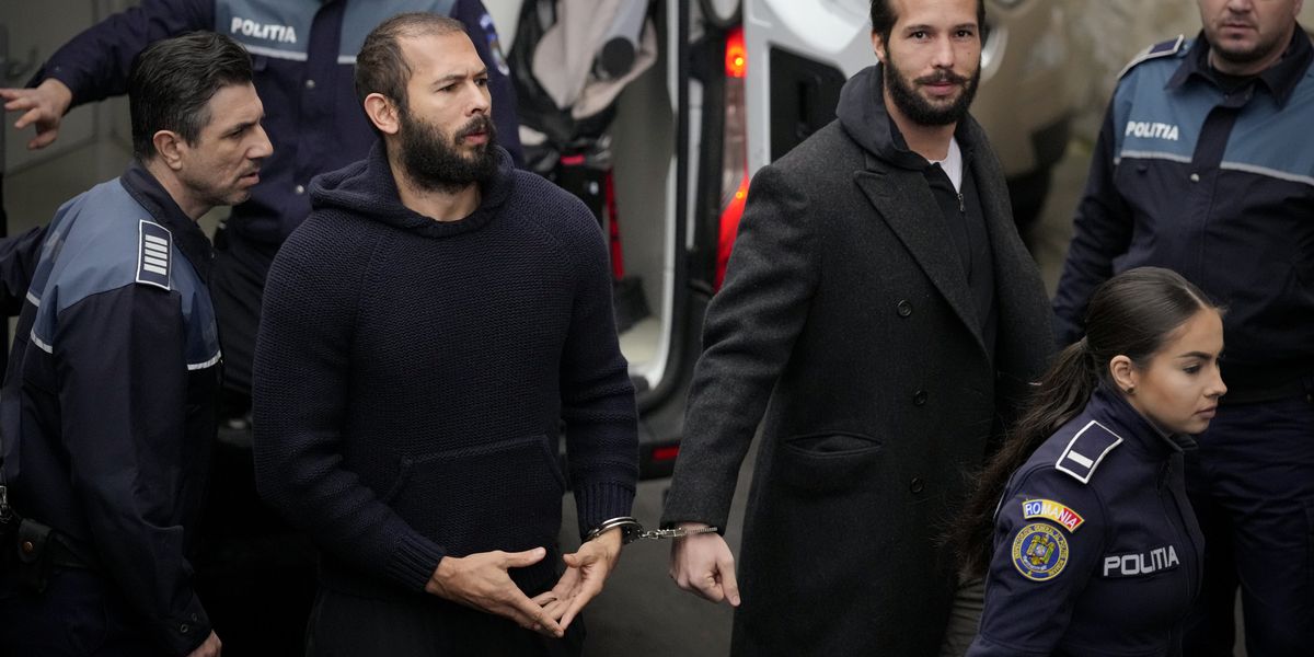 What is the meaning behind Andrew Tate's mysterious hand sign? | indy100