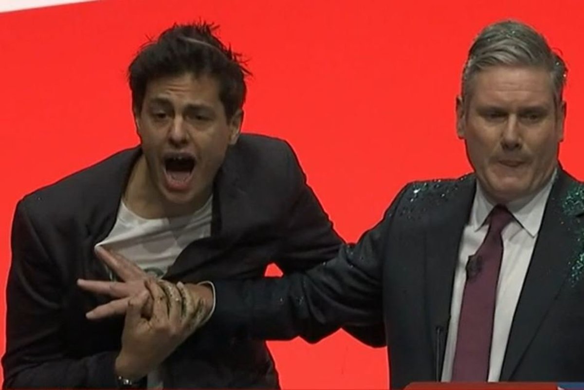 Keir Starmer conference speech: intruder storms stage and covers Labour leader in glitter