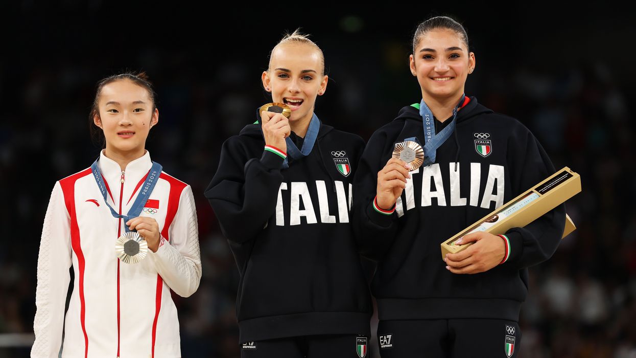 Chinese gymnast's reaction to opponents biting medals called the 'cutest moment of the Olympics'