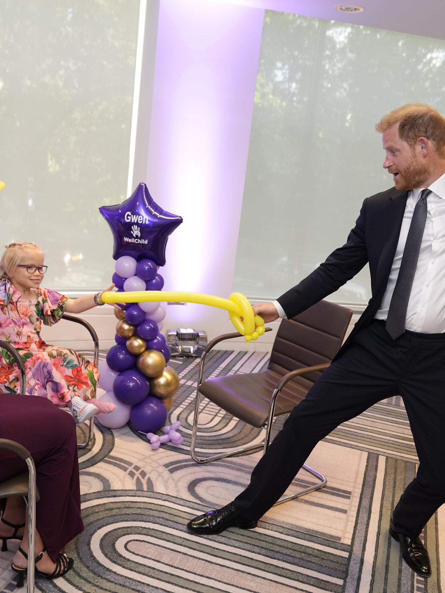 Watch touching moment Prince Harry duels with young girl at WellChild Awards