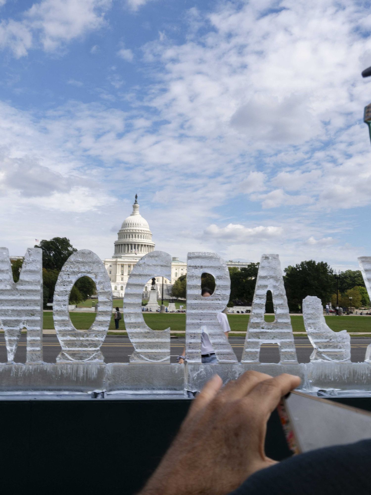 Ice sculpture of 'Democracy' melts on Washington DC's National Mall