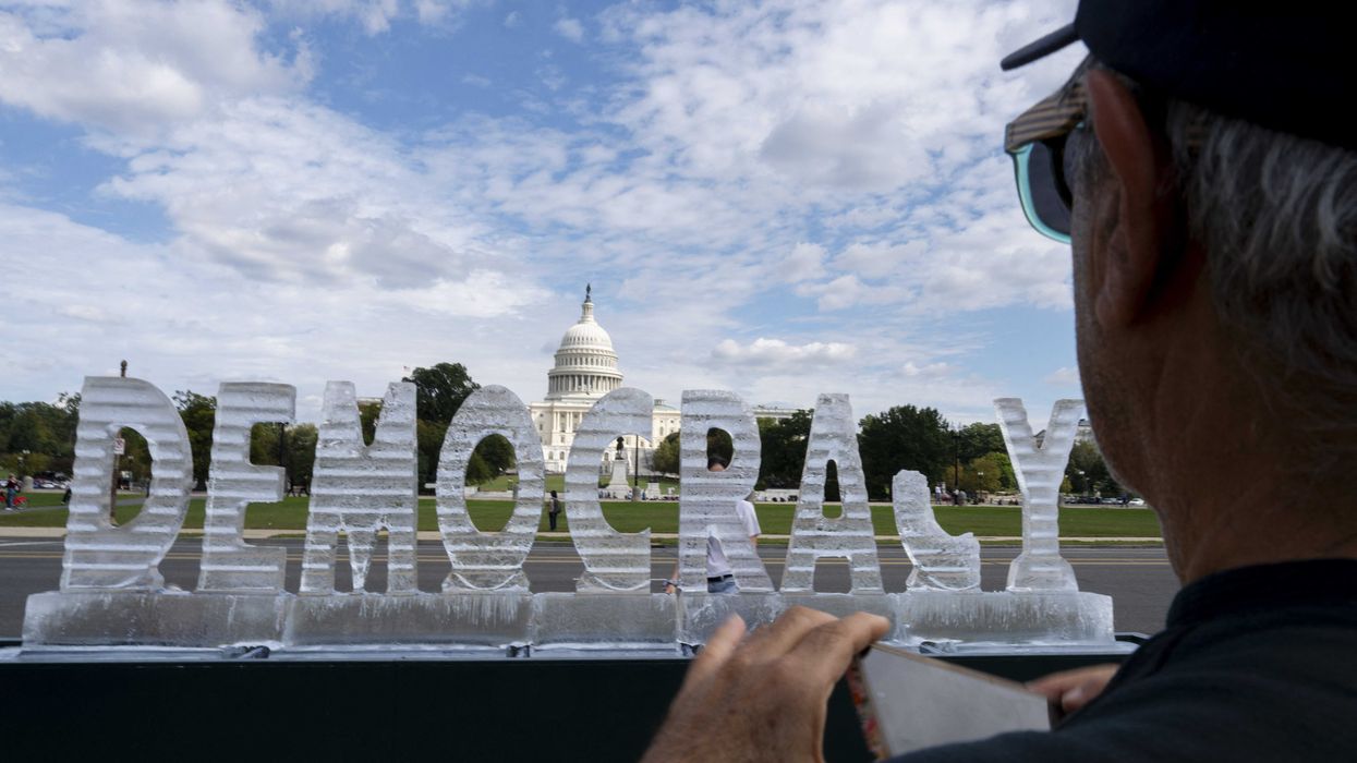 Ice sculpture of 'Democracy' melts on Washington DC's National Mall