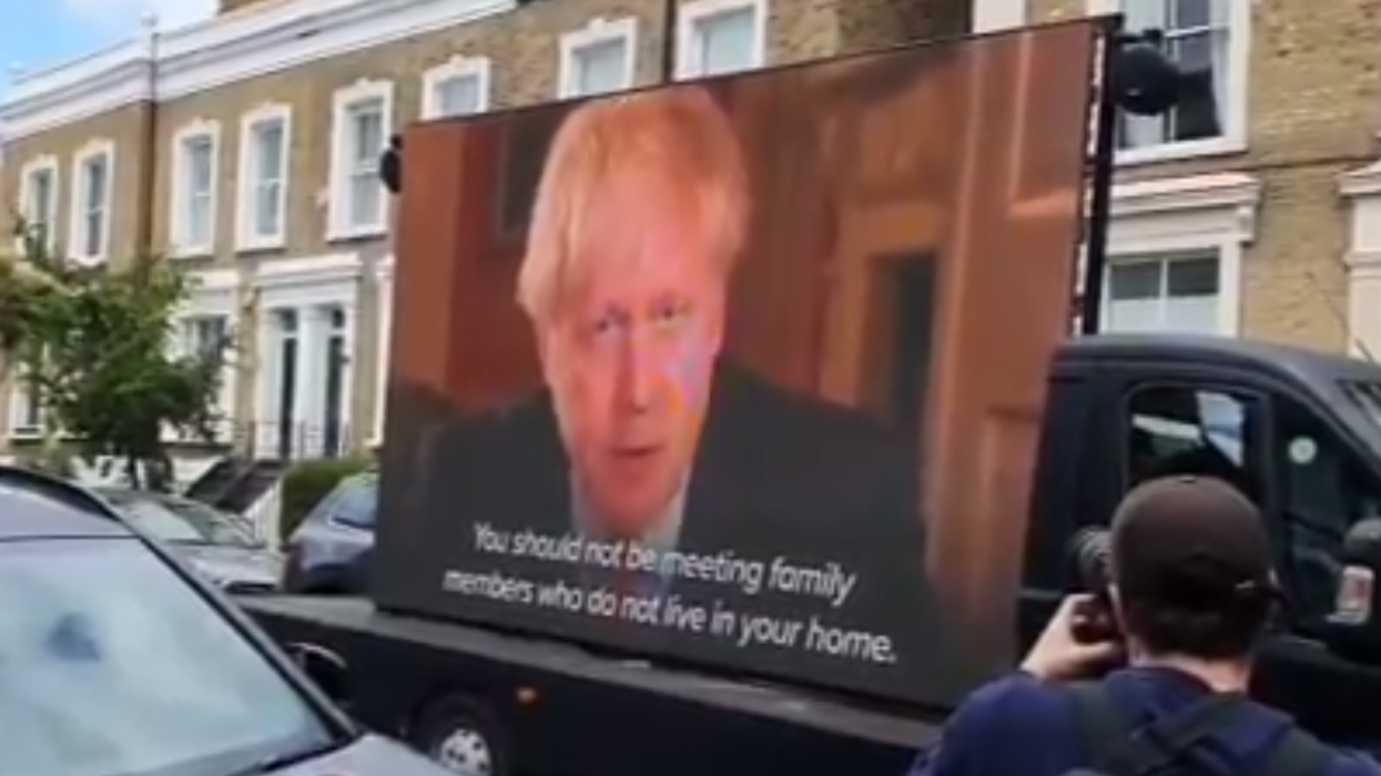 Pranksters are playing Boris Johnson's 'stay at home' address outside Dominic Cummings' home on a huge screen
