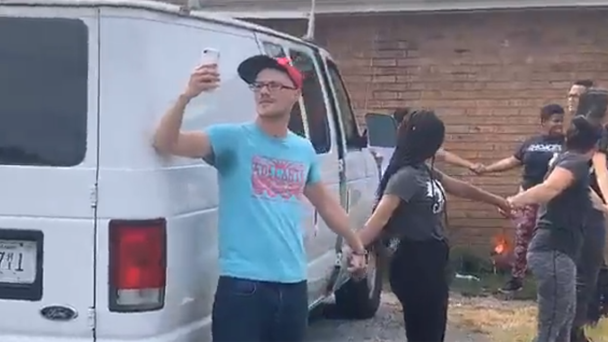 Group of neighbors form human chain to protect father and son from immigration raid