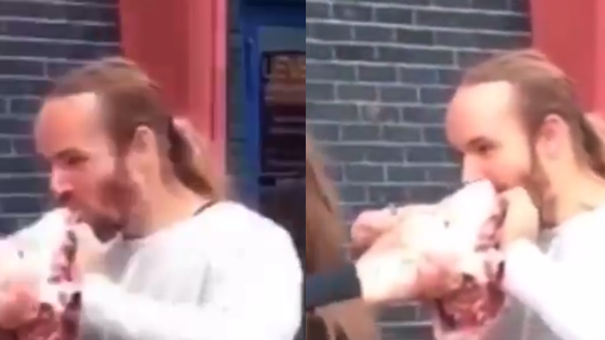 Man protests outside a vegan festival by eating a raw pig's head - gross out ensues