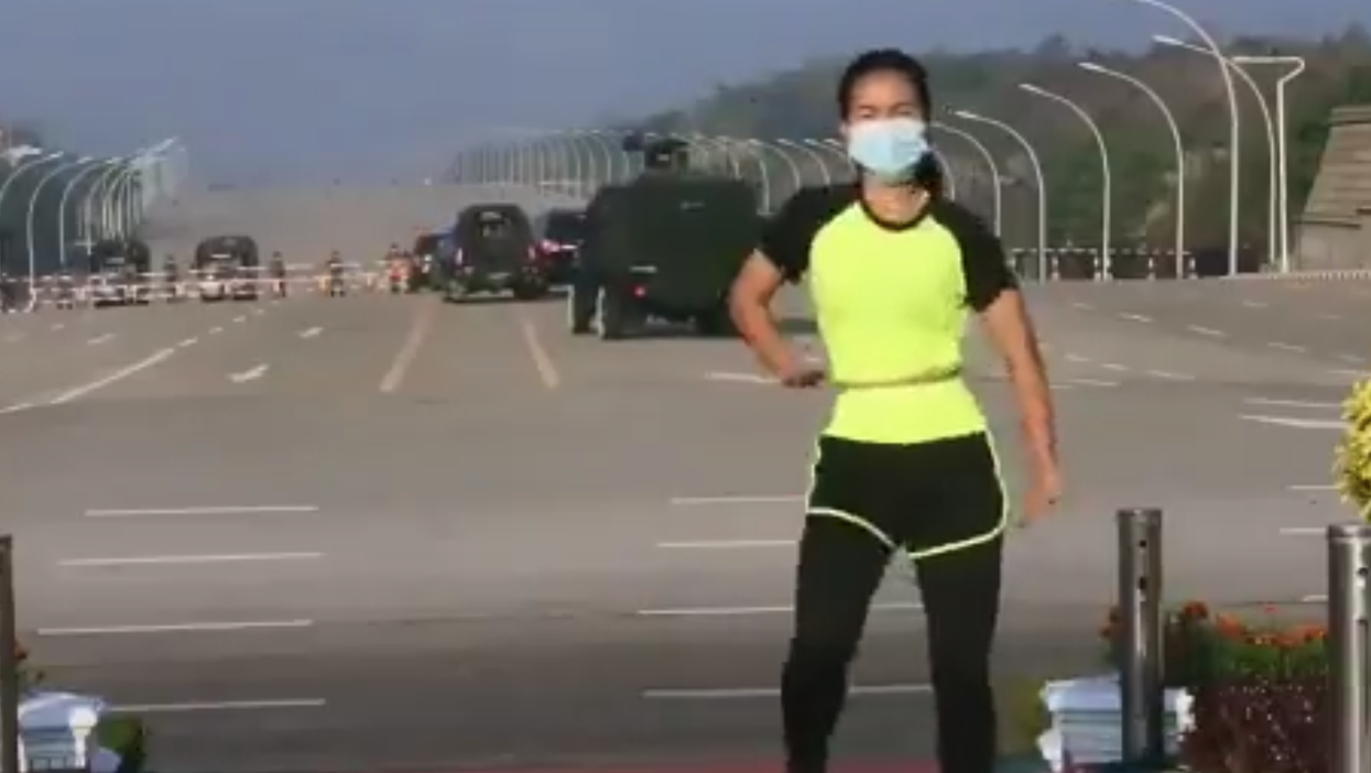 Aerobics instructor in Myanmar  continues routine blissfully unaware of military coup happening behind her