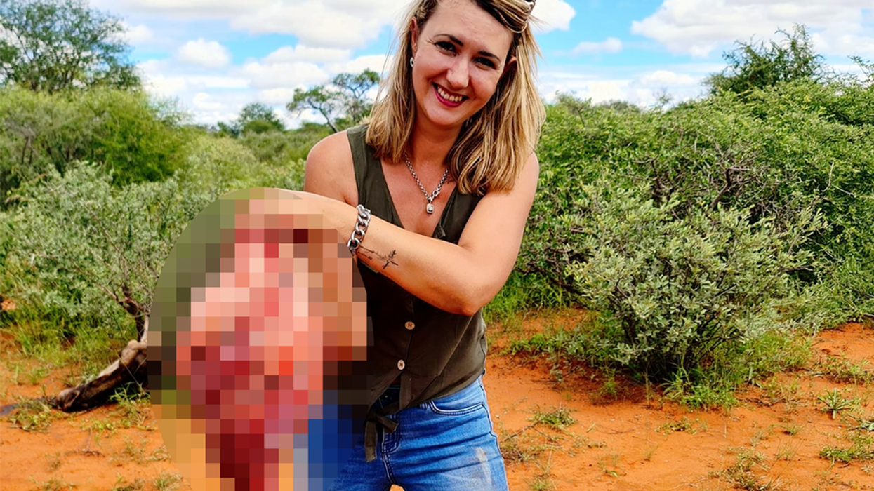 Thousands sign petition against trophy hunter who  proudly posed with heart of dead giraffe