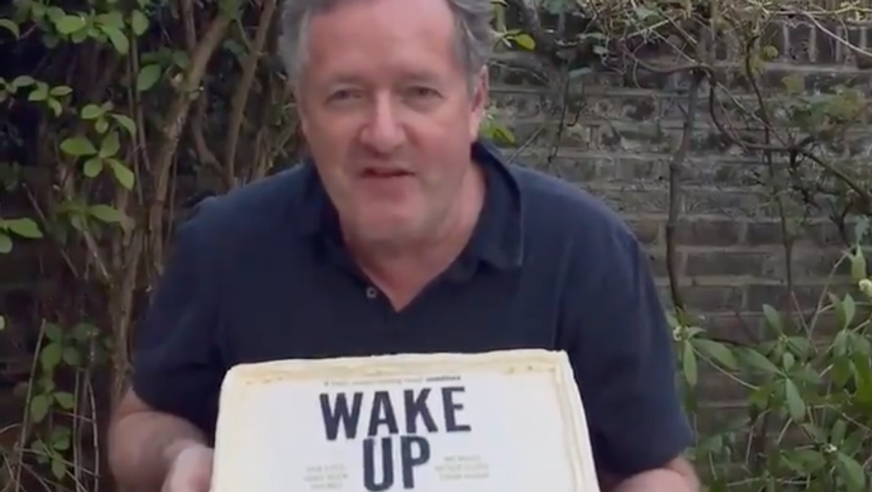 Watch Piers Morgan get a cake shoved in his face on his birthday