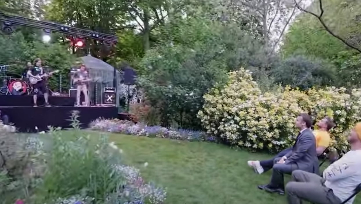 French president Emmanuel Macron rocked out to death metal in his garden after losing a YouTube bet