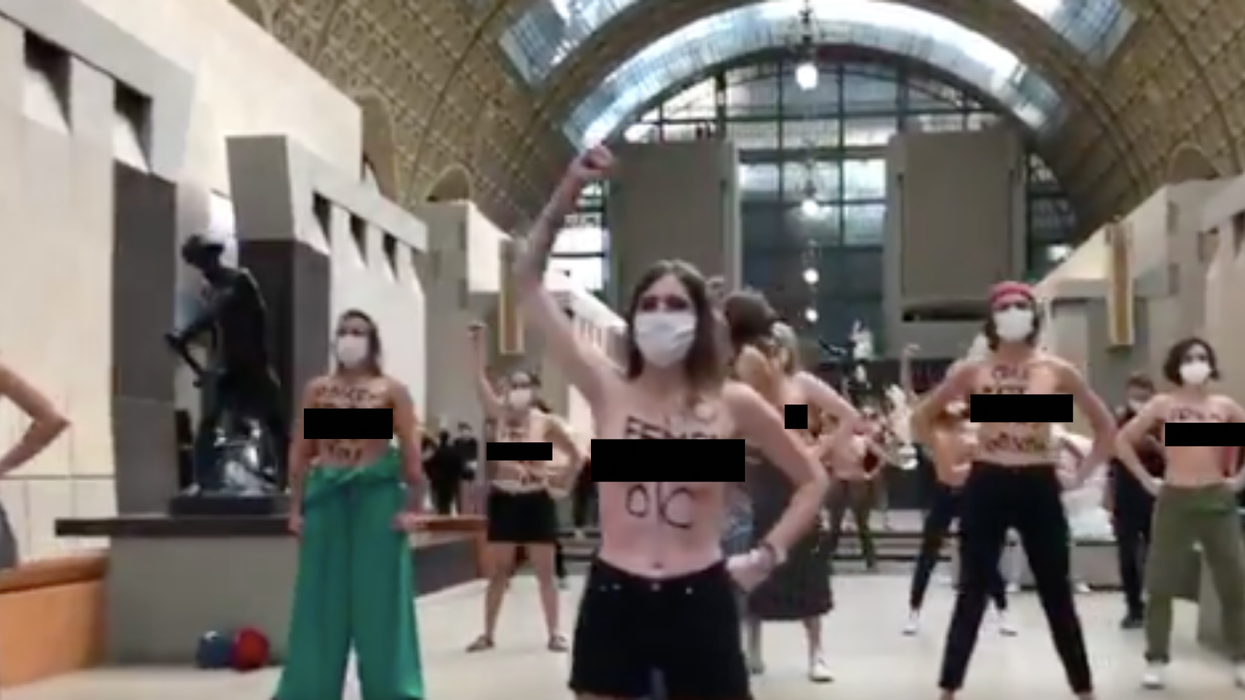 Topless feminists protest in French museum after woman refused entry for showing cleavage