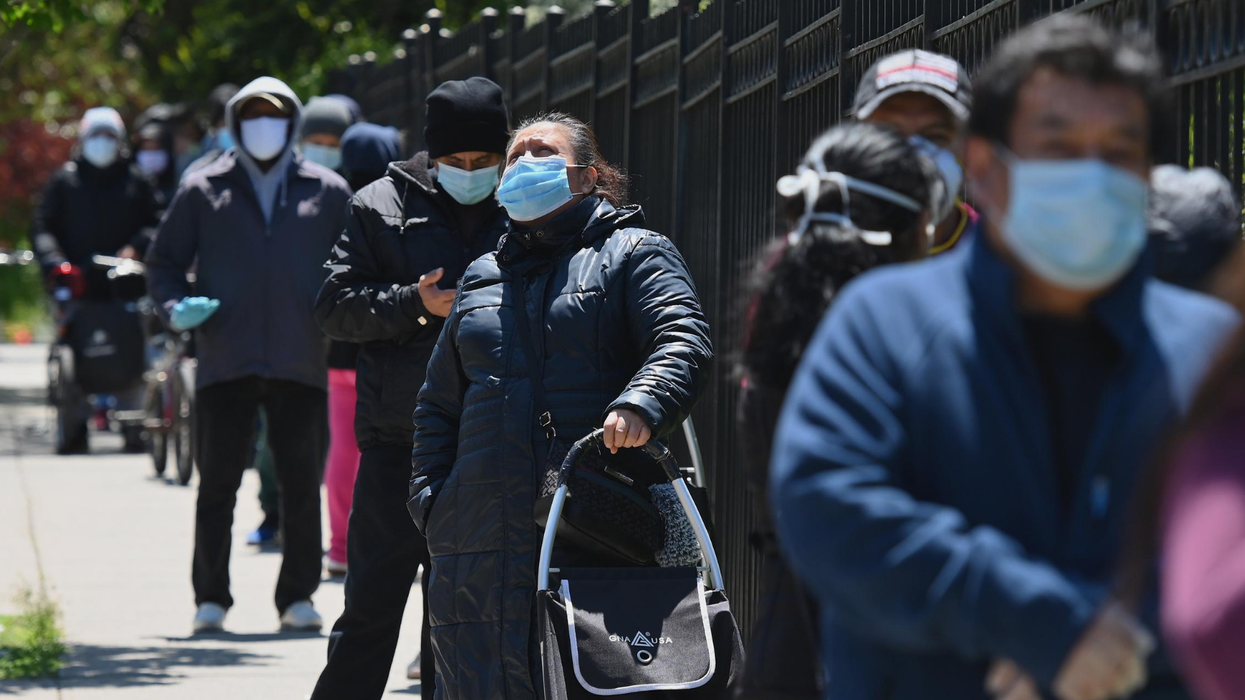 Devastating pictures show thousands queuing for free food in New York