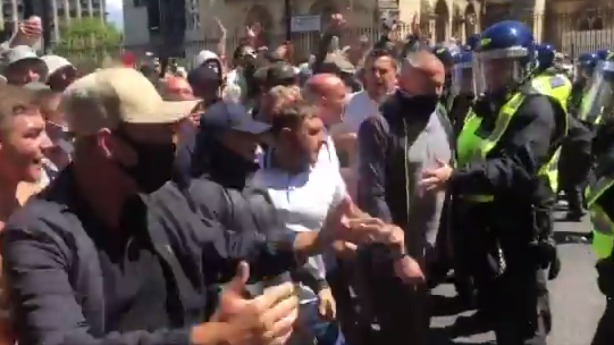 Violence erupts in London as far-right protesters filmed attacking police with punches and bottles