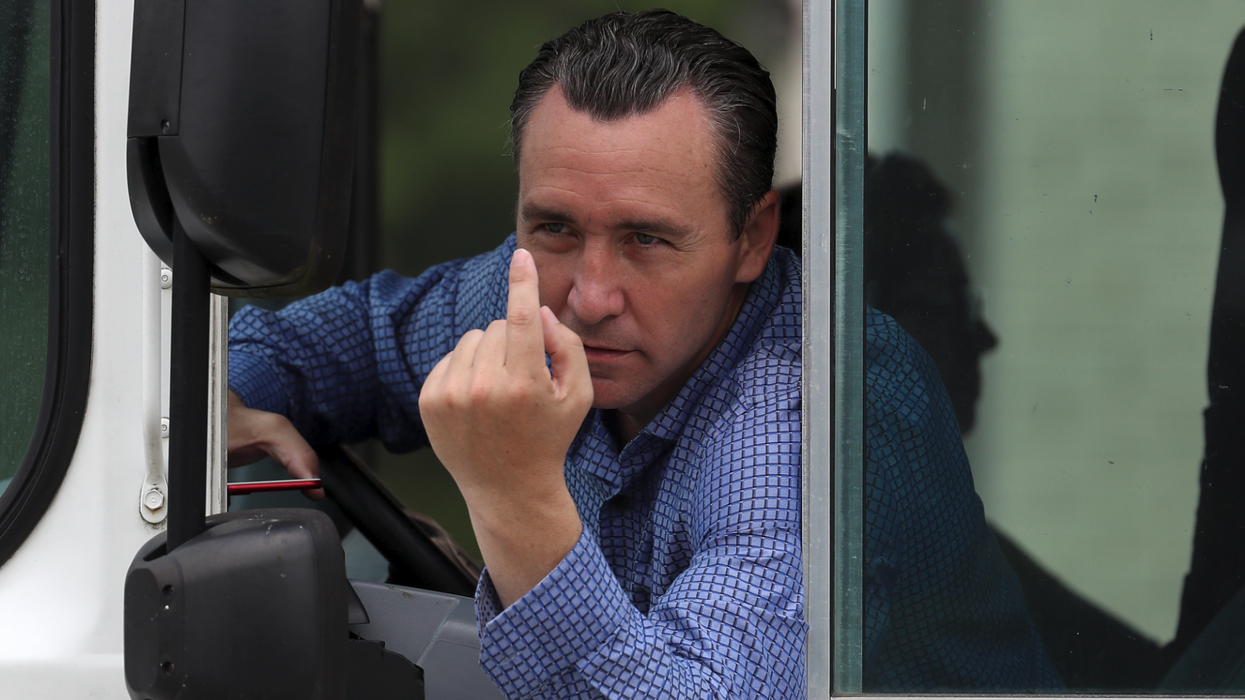 Pastor who refused to stop holding in-person services arrested after driving a bus towards peaceful protester