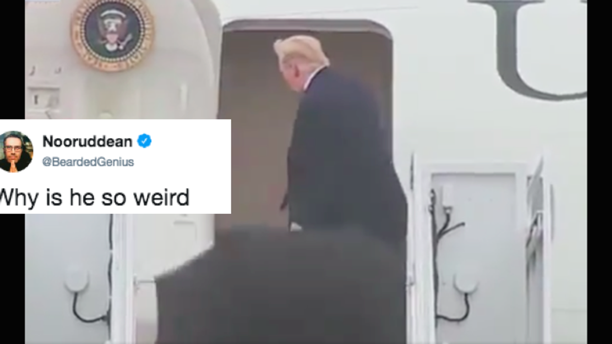 It looks like Donald Trump doesn't know how to use an umbrella