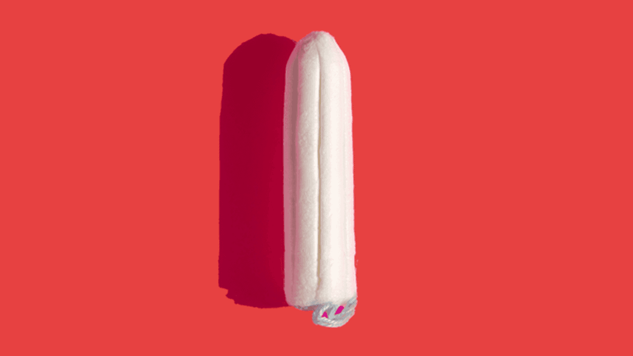 Women bleed onto their white trousers to protest tampon tax outside Houses of Parliament