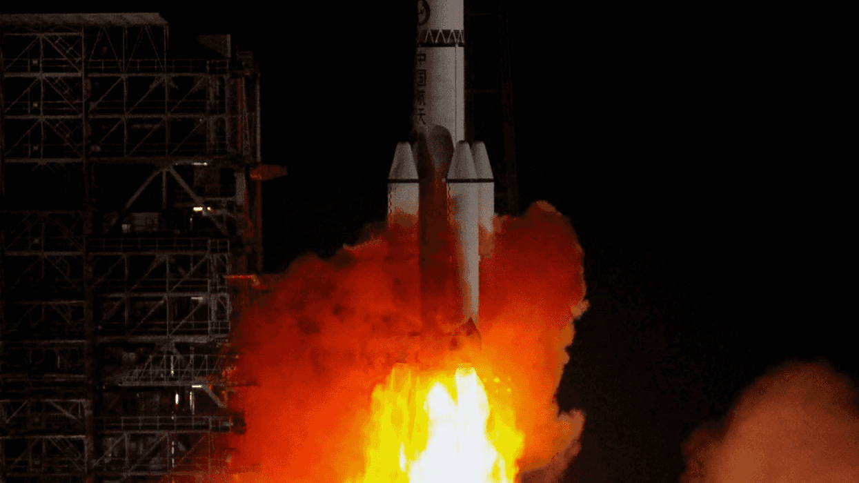 Onlookers film rocket booster crash-land near small town in China