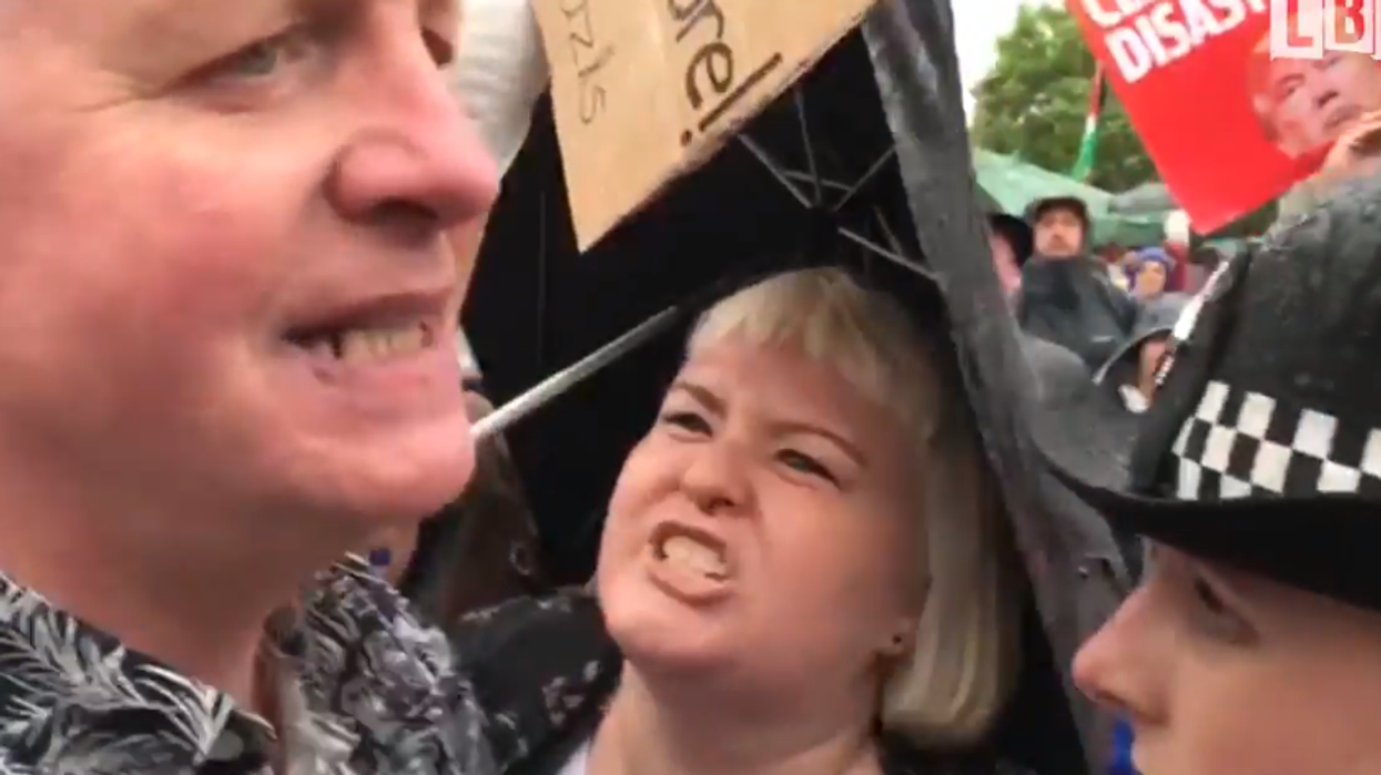 Protester apologises for shouting 'Nazi scum' at a Donald Trump supporter