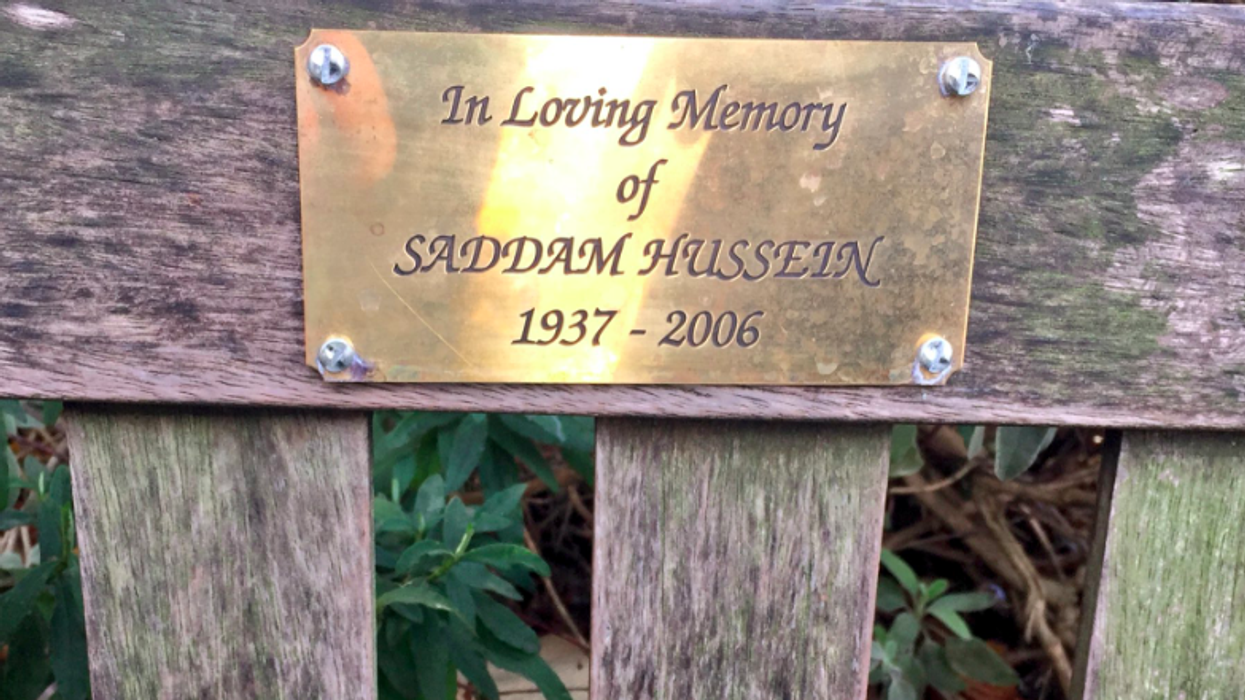 A plaque 'in loving memory of Saddam Hussein' has appeared on a bench and people are outraged