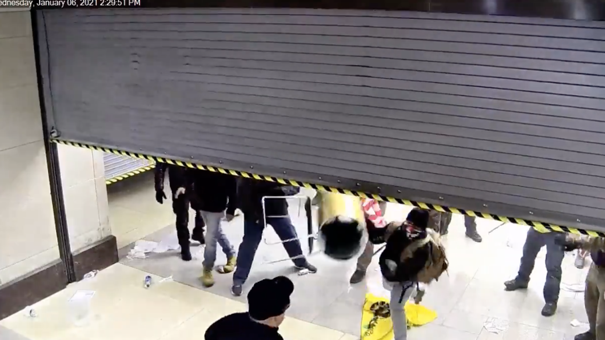 Chilling footage shows Capitol cops' losing battle to shut out tear-gas spraying rioters