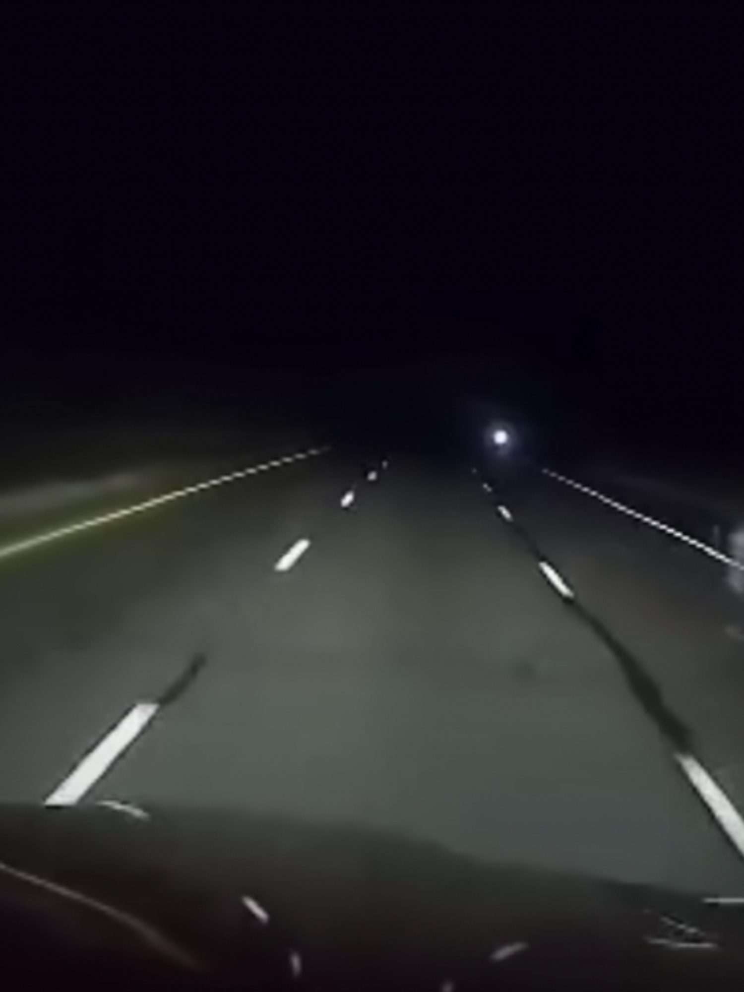 Trucker films creepy ghost-like figure on highway while driving alone